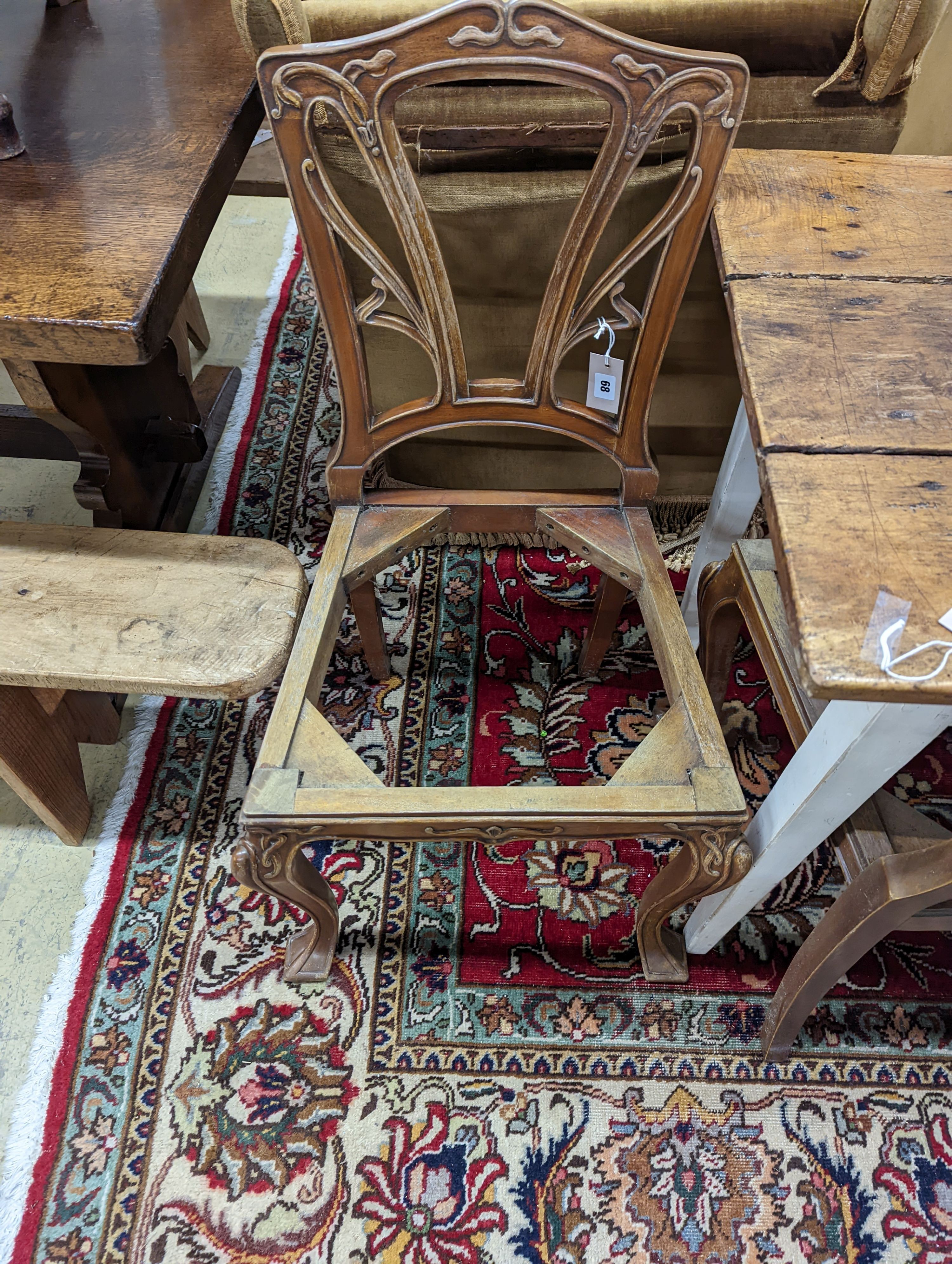 A set of six Majorelle style mahogany dining chairs (no seats). H-92cm.